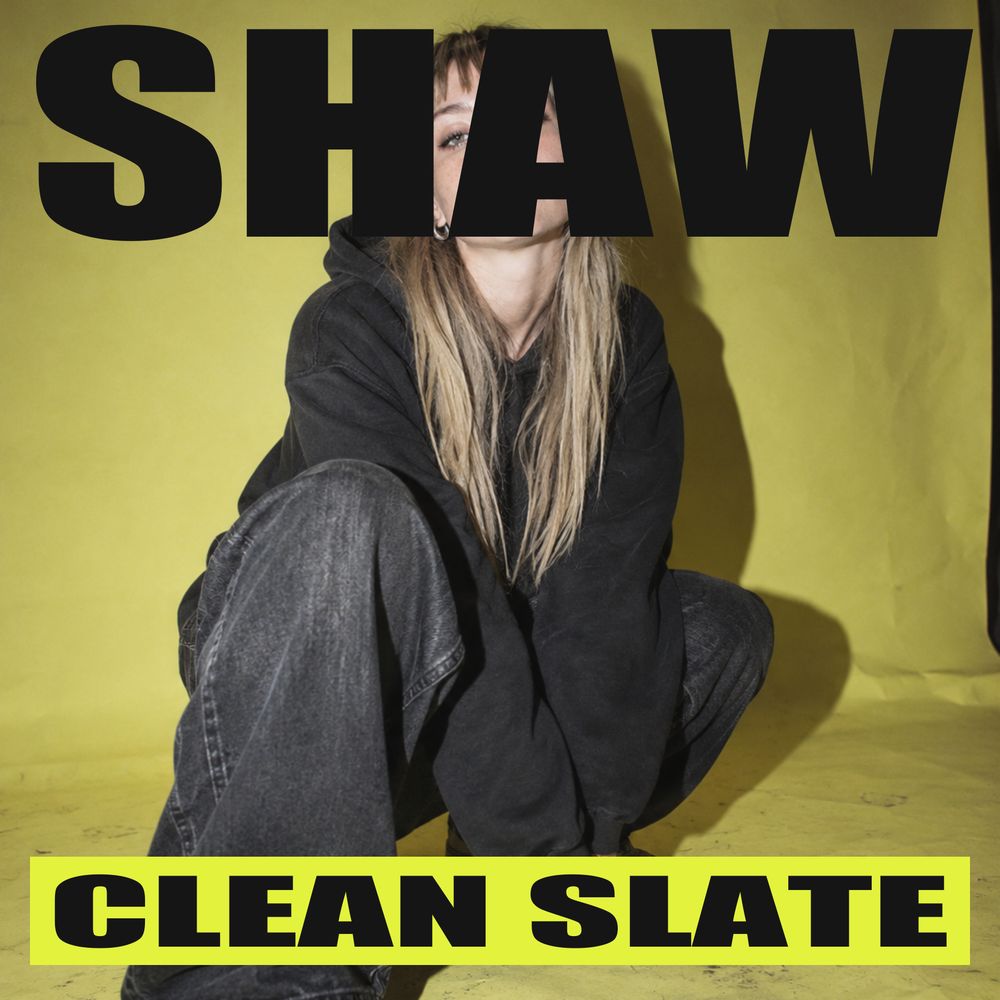 Clean Slate album cover: SHAW in black type over a crouching portrait on yellow, with CLEAN SLATE on an acid label.